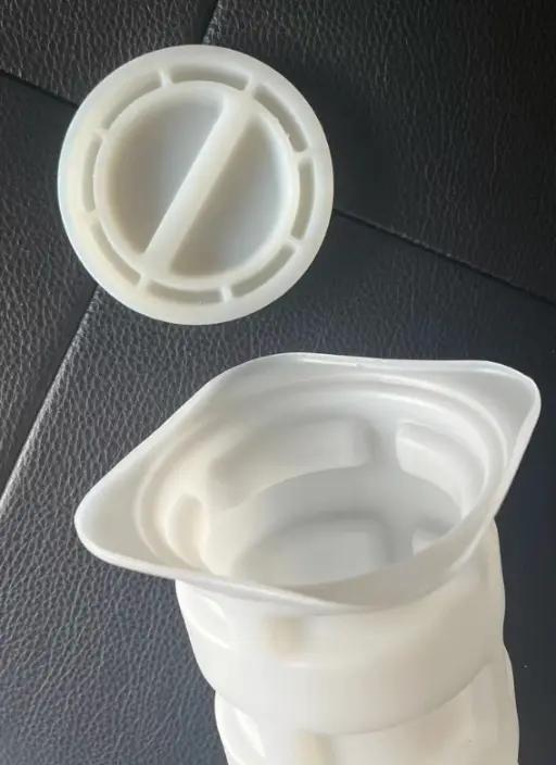 Heavy-duty plastic caps and block-out tubes for protecting anchor points during the concrete pouring process.