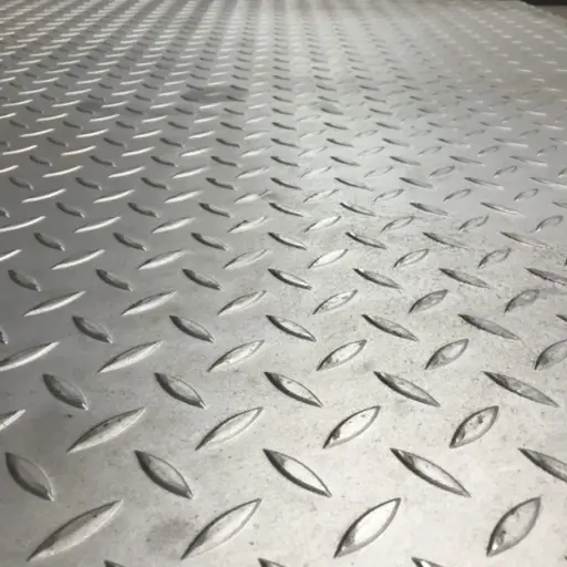 Solid diamond plate safety covers for steel grating to prevent debris from falling through industrial floors.